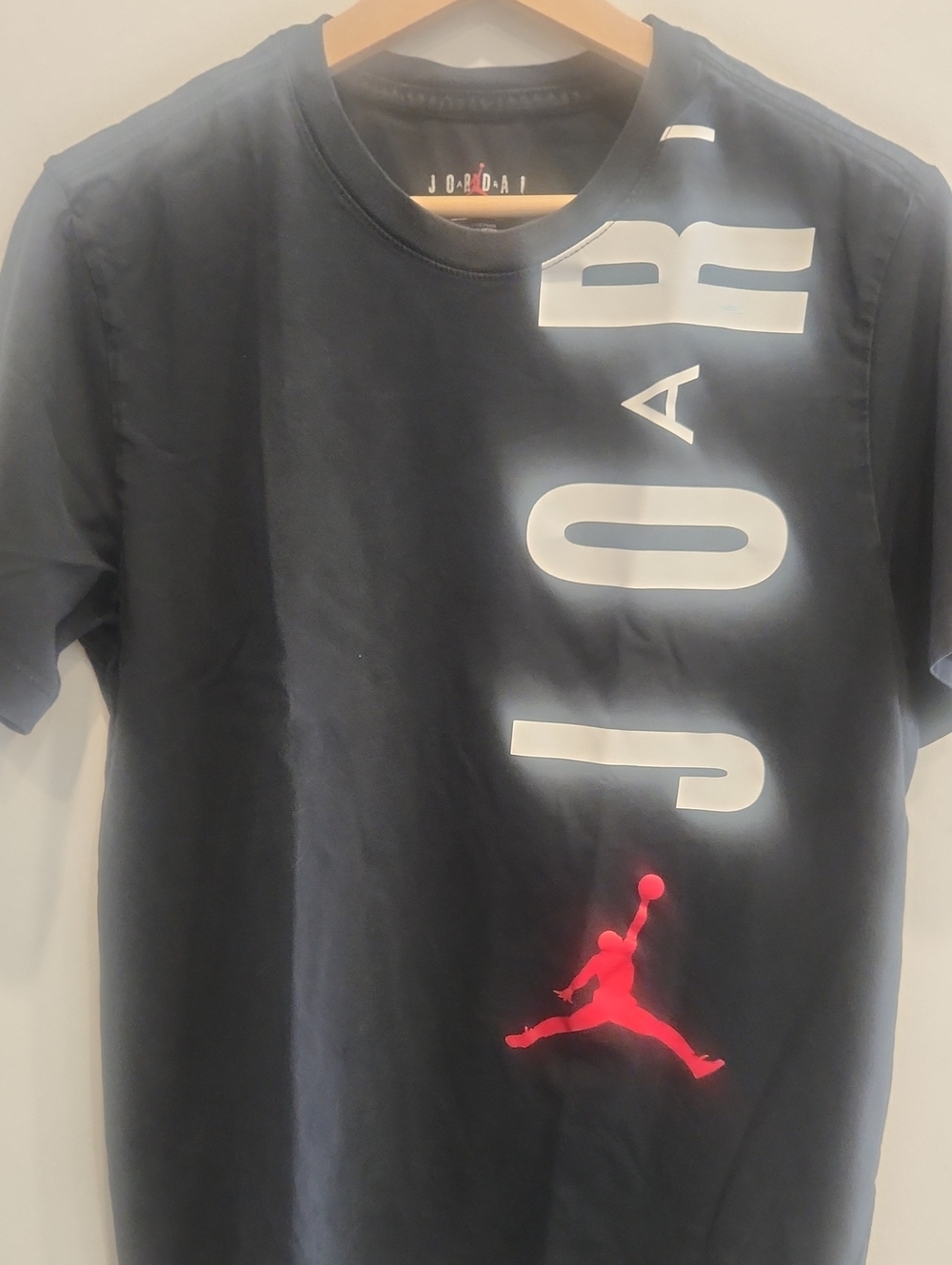 Jordan Black Short-Sleeve Tee with White Vertical Logo and Red Jumpman
